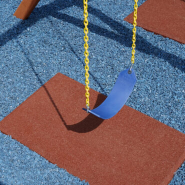 Redwood Rubberific Mat on Blue Rubber Mulch