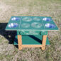 The Island Mud Kitchen is made of recycled wood, HDPE plastic and 4 removable stainless steel bowls