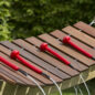 The Akadinda frame is made of a treated timber suitable to be installed into the ground or surface mounted.